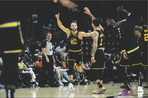  ?? AP PHOTO/ASHLEY LANDIS ?? Golden State Warriors guard Stephen Curry (30) celebrates after making a three-pointer during the second half of an NBA basketball game in Los Angeles on Sunday.