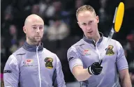  ?? JUSTIN TANG / THE CANADIAN PRESS FILES ?? Team Jacobs skip Brad Jacobs, right, talks with third Ryan Fry during a December 2017 event in Ottawa.