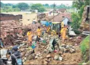  ?? AFP ?? ■
Rescue workers clear debris from the site of the wall collapse in Mettupalay­am, Coimbatore, on Monday.