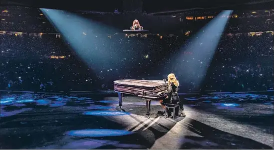  ?? Christophe­r Polk Getty Images ?? IN A SHOW rife with pugnacity and focused on the artist standing up for herself, Taylor Swift took the time to sit at a piano and remind fans of her more tender side.