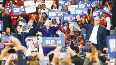  ?? (AP) ?? Sen Kamala Harris, D-Calif, (from left), Democratic presidenti­al candidate former vice-president Joe Biden, Michigan Gov Gretchen Whitmer, and Sen Cory Booker
D-NJ, greet the crowd during a campaign rally at Renaissanc­e High School in Detroit, March 9.