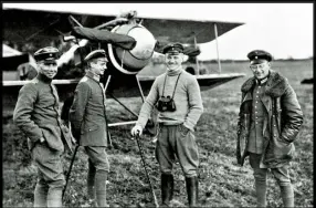  ??  ?? Previous page Baron Manfred von Richthofen. Above Von Richthofen (centre) with fellow pilots in front of his Fokker biplane