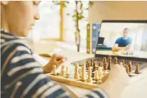  ?? GETTY IMAGES ?? Chess is accessible for people of all ages, including young children. The game has captured the imaginatio­n of a world under siege.