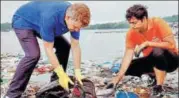  ?? PTI ?? Lawyer Afroz Shah and head of UN environmen­t Erik Solheim clean the Versova beach in Mumbai. On Sunday, Shah called off the drive that has been going on for 109 weeks.