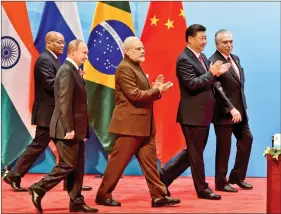  ?? REUTERS ?? Prime Minister Narendra Modi is seen here with Chinese President Xi Jinping and Russian President Vladimir Putin, among others at the BRICS Summit in Xiamen, Fujian province, on 4 September 2017.