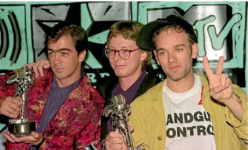  ??  ?? Bill Berry, Mike Mills and Michael Stipe at the height of REM’s fame in 1991.