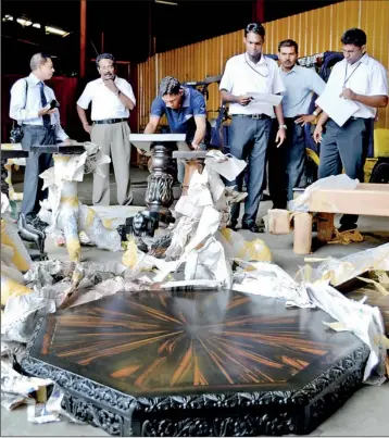  ??  ?? Sri Lanka Customs last week confiscate­d several valuable items of antique furniture from a 40-foot container before they were smuggled out of the country. Samantha Gunasekera, Deputy Director of the Customs Biodiversi­ty and Protection Unit (BPU) said...