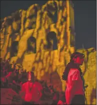  ??  ?? Stewards wearing plastic visors stand at the Odeon of Herodes Atticus in Athens during a concert July 15.