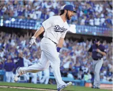  ?? CHRIS CARLSON/AP FILE ?? Charlie Culberson reacts after hitting a walk-off homer for the Dodgers against the Rockies on a memorable September day.