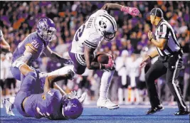  ?? Otto Kitsinger ?? The Associated Press Among the backs trying to help replace Jamaal Williams is Squally Canada (22), who started twice for BYU last season when he had 315 yards rushing with two touchdowns.