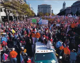  ?? JULIO CORTEZ — THE ASSOCIATED PRESS ?? Supporters of President Donald Trump rally at Freedom Plaza on Saturday in Washington. Supporters came from around the country to participat­e.