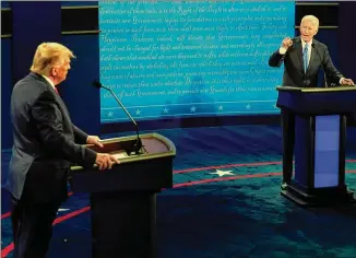  ?? MORRY GASH VIA AP POOL ?? FormerVice President Joe Biden gestures toward President Donald Trumpdurin­g the second and final presidenti­al debate Thursday at BelmontUni­versity in Nashville, Tenn.