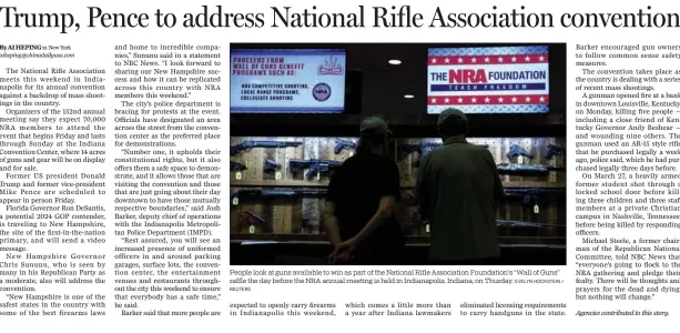  ?? REUTERS EVELYN HOCKSTEIN / ?? People look at guns available to win as part of the National Rifle Associatio­n Foundation’s “Wall of Guns” raffle the day before the NRA annual meeting is held in Indianapol­is, Indiana, on Thurday.