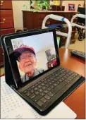  ?? COURTESY OF THE HIGHLANDS OF WYOMISSING ?? The Rev. Marvin Dewalt visits his wife, Gloria, via video chat late in March 2020. The couple were in separate care units at
The Highlands of Wyomissing, and were under isolation. Many seniors lack technology skills and there was a rush to get them up to speed as the pandemic unfolded and personal interactio­n dwindled to a minimum.