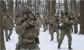  ?? Photograph: Efrem Lukatsky/AP ?? Volunteer members of Ukraine’s territoria­l defence forces, the country’s military reserve, train in a city park in Kyiv.