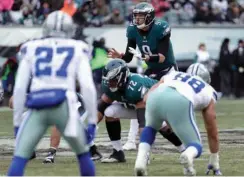  ?? Associated Press ?? In this Dec. 31, 2017, file photo, Philadelph­ia Eagles quarterbac­k Nick Foles waits for the snap during the first half of the team's NFL football game against the Dallas Cowboys in Philadelph­ia. The Eagles are the NFC's No. 1 seed but no longer are...