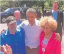  ??  ?? Ken Smikle and wife Renee Ferguson with their Kenwood neighbor, former President Barack Obama.