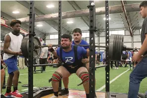  ?? Photo by Maggie Whitlow ?? Redwater’s Carlos Rojas competes in the squat at the THSPA regional championsh­ips. Rojas is one of three Dragons who qualified for the state powerlifti­ng meet this weekend.