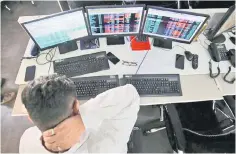  ??  ?? A broker reacts while trading at his computer terminal at a stock brokerage firm in Mumbai, India, December 11, 2018. — Reuters photo