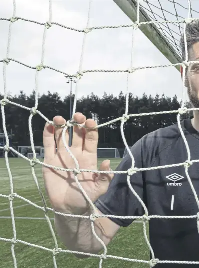  ?? ?? Craig Gordon takes a break from Hearts training at the Oriam yesterday and, left, with the Scotland squad at Lesser Hampden in March