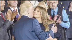  ?? EPA ?? US President Donald Trump kisses his wife Melania during a news conference in Washington on Friday.