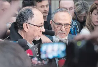  ?? JACQUES BOISSINOT
THE CANADIAN PRESS ?? Quebec Islamic Cultural Centre members Boufeldja Benabdalla­h, left, and Mohamed Labidi speak at a news conference Wednesday following Alexandre Bissonnett­e’s guilty plea for the 2017 mosque shooting.