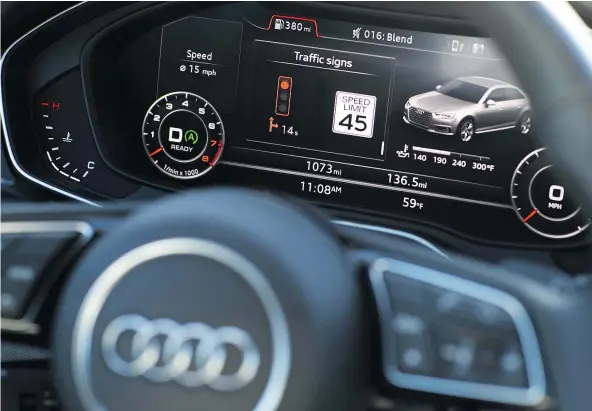 ?? — THE ASSOCIATED PRESS FILES ?? The dashboard of an Audi A4 demonstrat­es Audi’s vehicle-to-infrastruc­ture technology in Las Vegas. The technology allows vehicles to ‘read’ red lights ahead and tell the driver how long it will be before the signal turns green.