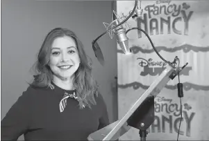  ?? PAUL HEBERT/DISNEY JUNIOR VIA AP ?? This March 2, 2018 photo released by Disney Junior shows Alyson Hannigan, who voices the character Claire Clancey for the animated series “Fancy Nancy,” at a recording session in Los Angeles.