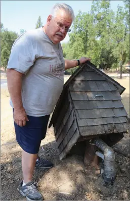  ?? Guy Mccarthy
/ Union Democrat ?? Terry Carney shows the head of his well on his Soulsbyvil­le Road property, which he says dried up about two weeks after the July 9 magnitude 6.0 earthquake that struck near Walker, Nevada, and was felt by people up and down the Sierra Nevada and as far west as the Bay Area.