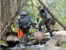  ?? ?? Michael Miller and Kelsie Field, graduate student researcher­s from New Mexico State University, electrofis­h a small stream that runs through Vermejo Park Ranch – all part of a bold experiment to help restore the West’s native trout population­s. Photograph: Jeremy Miller