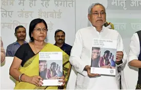  ??  ?? UNEASY COMPANY Nitish Kumar with social welfare minister Manju Verma on August 3