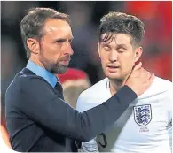  ??  ?? John Stones with England boss Gareth Southgate