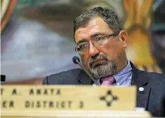  ??  ?? County Commission­er Robert Anaya, District 3, listens Tuesday night as Carmichael speaks in favor of the gross receipts tax increase.