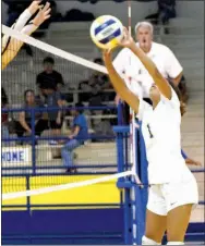  ?? Westside Eagle Observer/MIKE ECKELS ?? Lady Bulldog Desi Meek (1) hits a ball back over the net into Lady Hornets’ territory during the second set of the Decatur-Hackett varsity volleyball match at Peterson Gym in Decatur on Sept. 4.