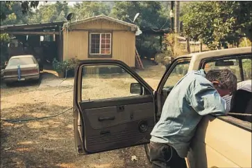  ?? Marcus Yam Los Angeles Times ?? ARNULFO BASABE weeps with joy after discoverin­g that his trailer home is still standing in the Stanley Park Road neighborho­od of Carpinteri­a, which had been heavily damaged by the Thomas fire.