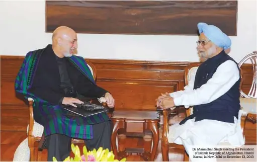  ??  ?? Dr Manmohan Singh meeting the President of Islamic Republic of Afghanista­n, Hamid Karzai, in New Delhi on December 13, 2013