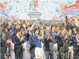  ??  ?? Japan players celebrate after winning the AFC Women’s Asian Cup title.