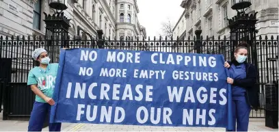  ?? PA ?? NHS workers holding a socially distanced protest outside Downing Street