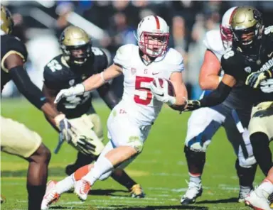  ??  ?? Stanford’s Christian McCaffrey, rushing for some of his 151 yards against Colorado in November at Folsom Field, finished second in the Heisman Trophy race last year. Daily Camera file