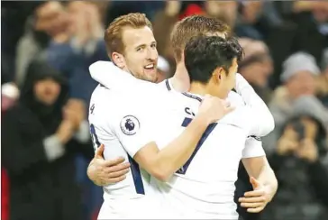  ?? IAN KINGTON/AFP ?? Tottenham Hotspur’s English striker Harry Kane (left) celebrates scoring his team’s third goal during the English Premier League match against Everton at Wembley Stadium on Saturday.