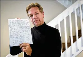  ?? BRUCE R. BENNETT / THE PALM BEACH POST ?? Dave Barker holds a page from a packet of letters he received from cult leader Charles Manson. Barker, then a broadcast journalist for the CBS affiffilia­te in Los Angeles, said the letters “gave me the shivers.” Barker, of Boynton Beach, now teaches...