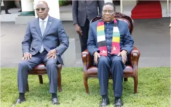  ?? — ?? The President poses with the incoming Mozambican Ambassador to Zimbabwe Mr Carvalho Muaria at State House yesterday