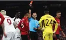  ?? Staples/AFP/Getty Images ?? Casemiro is shown a red card while André Onana looks on. Photograph: Darren