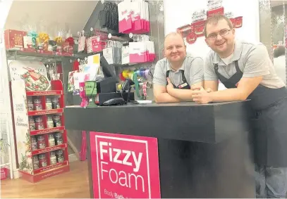  ??  ?? Dave Easterbroo­k, 27, right, is celebratin­g the fifth anniversar­y of his business Fizzy Foam in Bridgend. He is pictured with dad Steve Easterbroo­k, who is a director of the company