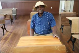  ?? ?? James sits in a classroom July 11 at a restored Rosenwald School made to look like it did when the school was open.