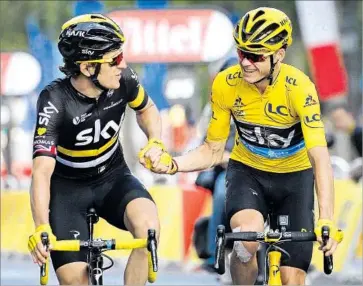  ?? Christophe Ena Associated Press ?? CHRIS FROOME, wearing the overall leader’s yellow jersey, celebrates with Sky teammate Geraint Thomas as they approach the finish line of the 21st stage of the Tour de France.