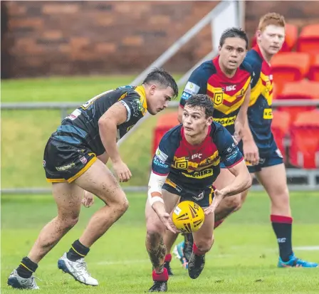  ?? Picture: Nev Madsen. ?? NEW LOOK: Brandon Clarke fires off a pass for the Western Mustangs. The Mustangs have rebranded as the Western Clydesdale­s as they work toward a 2023 Intrust Super Cup return.