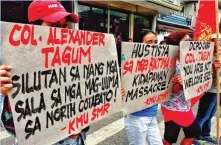  ??  ?? Militants protest the appointmen­t of Senior Superinten­dent Alexander Tagum as the new Davao City police chief in this photo released by Kilab Multimedia to the Mindanao Examiner Regional Newspaper.