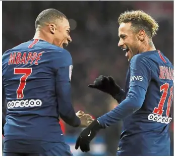  ?? — AP ?? Way to go: PSG’s Kylian Mbappe (left) celebratin­g after scoring his side second goal with Neymar during the Ligue 1 match against Lille in Paris on Friday.