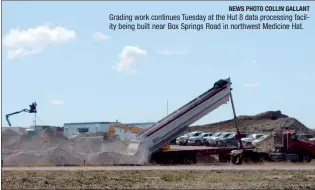  ?? NEWS PHOTO COLLIN GALLANT ?? Grading work continues Tuesday at the Hut 8 data processing facility being built near Box Springs Road in northwest Medicine Hat.